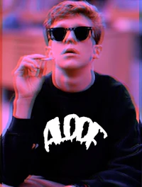 a man in sunglasses smoking a cigarette